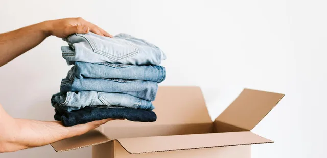 Donations ready for pickup - clothing and items in a box
